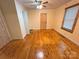 Cozy bedroom with original hardwood floors, paneled ceiling and natural light at 2131 E Nc 10 Hwy, Conover, NC 28613