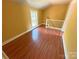 A bedroom with hardwood floors, natural light and a stairway at 2131 E Nc 10 Hwy, Conover, NC 28613