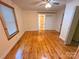 Bright bedroom with wooden floors, natural light, and a sliding barn door leading to the bathroom at 2131 E Nc 10 Hwy, Conover, NC 28613