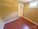Bedroom featuring wood floors, yellow walls, and a window at 2131 E Nc 10 Hwy, Conover, NC 28613