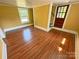 Bedroom featuring wood floors, yellow walls and a window at 2131 E Nc 10 Hwy, Conover, NC 28613