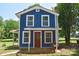Inviting two-story home featuring a cozy front porch with a swing at 2131 E Nc 10 Hwy, Conover, NC 28613