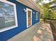 Charming blue home featuring white windows, a covered porch, and mature trees at 2131 E Nc 10 Hwy, Conover, NC 28613