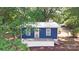 Charming blue cottage featuring a cozy front porch with a railing at 2131 E Nc 10 Hwy, Conover, NC 28613
