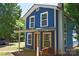 Charming blue two-story home with a cozy porch swing and inviting curb appeal at 2131 E Nc 10 Hwy, Conover, NC 28613