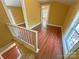 Hallway area with wood flooring and white trim, leading to additional rooms at 2131 E Nc 10 Hwy, Conover, NC 28613