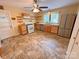 Bright kitchen featuring stainless steel refrigerator, natural wood cabinets and updated appliances at 2131 E Nc 10 Hwy, Conover, NC 28613