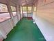 Sunroom with several windows and green carpeting at 2131 E Nc 10 Hwy, Conover, NC 28613