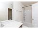 Bathroom featuring tub-shower combination with white tile surround and chrome fixtures at 2180 Shady Pond Dr, Clover, SC 29710