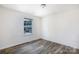 Bedroom with wood-look floors and lots of light from the window, with space to relax and unwind at 2180 Shady Pond Dr, Clover, SC 29710