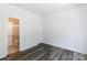 A well-lit bedroom with wood-look flooring and an en suite bathroom offering a modern touch at 2180 Shady Pond Dr, Clover, SC 29710