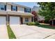 Charming townhome with stone accents, a one-car garage, and a well-maintained front yard at 2180 Shady Pond Dr, Clover, SC 29710