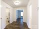 Hallway with hardwood floors, multiple doorways, and access to the attic at 2180 Shady Pond Dr, Clover, SC 29710