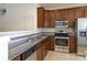 Modern kitchen with stainless steel appliances and granite countertops at 2180 Shady Pond Dr, Clover, SC 29710