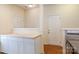Contemporary kitchen featuring white cabinets, wood countertop, and stainless-steel sink at 2180 Shady Pond Dr, Clover, SC 29710