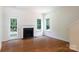 Bright living room with hardwood floors, a fireplace, and a door to the outdoor patio at 2180 Shady Pond Dr, Clover, SC 29710