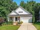 Charming home with a well-manicured lawn and inviting front porch at 2215 Henery Tuckers Ct, Charlotte, NC 28270