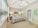 Spacious bedroom with trey ceiling, neutral carpet, and double windows at 2215 Henery Tuckers Ct, Charlotte, NC 28270