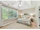 Serene main bedroom with trey ceiling, large windows, and neutral decor at 2215 Henery Tuckers Ct, Charlotte, NC 28270