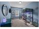 Blue bedroom featuring a bed lofted over a workspace with a desk and chair at 229 Cramerton Mills Pkwy, Cramerton, NC 28032