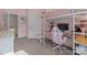 Pink bedroom featuring a bed lofted over a workspace with a desk and chair at 229 Cramerton Mills Pkwy, Cramerton, NC 28032