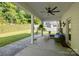 Inviting covered patio with outdoor seating and lush backyard views at 229 Cramerton Mills Pkwy, Cramerton, NC 28032