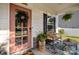 Charming front porch with pink door, wreath, and seating area at 229 Cramerton Mills Pkwy, Cramerton, NC 28032