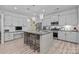 Modern kitchen with gray cabinets, granite counters, stainless steel appliances, and breakfast bar at 229 Cramerton Mills Pkwy, Cramerton, NC 28032