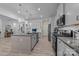 Well-lit kitchen with a granite island, stainless steel appliances, and lots of counterspace at 229 Cramerton Mills Pkwy, Cramerton, NC 28032