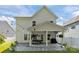 Beautiful covered patio with modern furniture, stylish pavers, fan, and manicured yard at 229 Cramerton Mills Pkwy, Cramerton, NC 28032