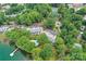 Aerial view capturing the building, pool, tennis court, and lush surroundings at 303 Northwest Dr, Davidson, NC 28036