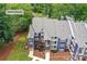 Aerial view showcases the building's exterior, landscaping, and unit address at 303 Northwest Dr, Davidson, NC 28036