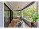 Balcony with wicker seating and bright green accents offers stunning views of the lush landscape at 303 Northwest Dr, Davidson, NC 28036