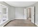 Light filled bedroom with a large window and laminated wood flooring at 303 Northwest Dr, Davidson, NC 28036