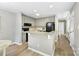 A well-lit kitchen features granite countertops and light gray cabinetry for a clean and modern aesthetic at 303 Northwest Dr, Davidson, NC 28036