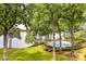 Lakefront community pool and green lawn with mature trees, offering a tranquil lakeside retreat at 303 Northwest Dr, Davidson, NC 28036