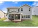 Backyard featuring a covered patio perfect for outdoor dining and a well-maintained lawn at 3212 Gilroy Dr, Fort Mill, SC 29707