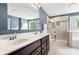 Bathroom features a double sink vanity, a glass shower, and soaking tub for relaxation at 3212 Gilroy Dr, Fort Mill, SC 29707