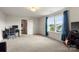 Spacious bedroom with neutral carpet, double windows and a desk with computer workstation at 3212 Gilroy Dr, Fort Mill, SC 29707