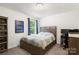 This bedroom features a classic bed frame, blue curtains, and a desk workstation at 3212 Gilroy Dr, Fort Mill, SC 29707