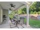 Inviting covered patio with ceiling fans, comfortable seating, and scenic backyard views at 3212 Gilroy Dr, Fort Mill, SC 29707