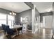 Dining room with large windows, stylish furniture, and elegant lighting fixtures, perfect for gatherings at 3212 Gilroy Dr, Fort Mill, SC 29707