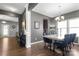 An alternate view of the dining room with large windows and decorative lighting, great for entertaining at 3212 Gilroy Dr, Fort Mill, SC 29707