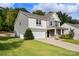 Two-story home showcasing a two-car garage, lush lawn, and inviting entryway, perfect for suburban living at 3212 Gilroy Dr, Fort Mill, SC 29707