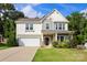 Charming two-story home featuring a two-car garage, well-manicured lawn, and delightful curb appeal at 3212 Gilroy Dr, Fort Mill, SC 29707