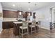 Modern kitchen with stainless steel appliances, granite countertops, and a breakfast bar for casual dining at 3212 Gilroy Dr, Fort Mill, SC 29707