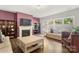 Cozy living room featuring a fireplace, built-in shelves, and large windows providing ample natural light at 3212 Gilroy Dr, Fort Mill, SC 29707