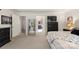 Cozy main bedroom boasts neutral decor, a mirror, and access to an ensuite bathroom at 3212 Gilroy Dr, Fort Mill, SC 29707