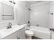 This is a well-lit bathroom featuring a tub and white tile at 326 Orchard Trace Ln # 3, Charlotte, NC 28213
