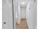 Hallway with tile floors, overhead lighting, and bi-fold closet doors at 326 Orchard Trace Ln # 3, Charlotte, NC 28213